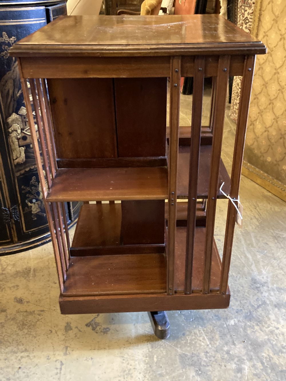 An Edwardian satinwood banded mahogany revolving bookcase, fitted drawers, width 48cm, depth 48cm, height 88cm
